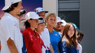 Members of the first U.S. Olympic skateboarding team stand on stage during a news conference in downtown Los Angeles on Monday, June 21, 2021. The team was introduced in Southern California, where the sport was invented roughly 70 years ago. Skateboarding is an Olympic sport for the first time in Tokyo, and the Americans are expected to be a strong team.