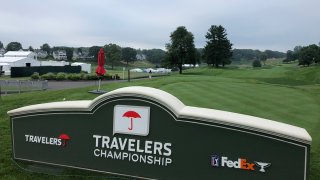Travelers Championship sign and part of the golf course at TCP River Highlands.