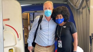 American Airlines CEO Doug Parker, left, and Southwest Airlines flight attendant JacqueRae Sullivan, right.
