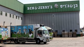 Truck are parked at the Ben & Jerry's ice-cream factory in the Be'er Tuvia Industrial area, Tuesday, July 20, 2021. Israeli Prime Minister Naftali Bennett told the head of Unilever on Tuesday that Israel will "act aggressively" against Ben & Jerry's over the subsidiary's decision to stop selling its ice cream in the Israeli-occupied West Bank and contested east Jerusalem.
