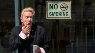 John Lydon, also known as Johnny Rotten, outside the Hight Court Rolls Building in London