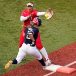 United States' Ali Aguilar (2) reaches first base for a single past Mexico's Victoria Vidales during the sixth inning a softball game at the 2020 Summer Olympics, Saturday, July 24, 2021, in Yokohama, Japan.