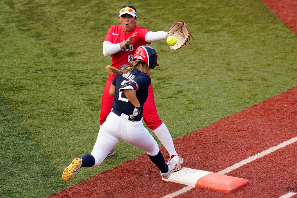 United States' Ali Aguilar (2) reaches first base for a single past Mexico's Victoria Vidales during the sixth inning a softball game at the 2020 Summer Olympics, Saturday, July 24, 2021, in Yokohama, Japan.