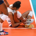 USA's Jordan Thompson reacts after getting injured in the women's preliminary round pool B volleyball match between USA and Russia during the Tokyo 2020 Olympic Games at Ariake Arena in Tokyo on July 31, 2021.