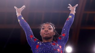 USA's Simone Biles competes in the artistic gymnastics balance beam event of the women's qualification during the Tokyo 2020 Olympic Games at the Ariake Gymnastics Centre in Tokyo on July 25, 2021.