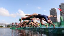 Summer Rappaport of Team United States and other competitors dive during the Mixed Relay Triathlon on day eight of the Tokyo 2020 Olympic Games at Odaiba Marine Park on July 31, 2021 in Tokyo, Japan.