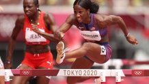 Mulern Jean of Team Haiti and Kendra Harrison of Team United States compete in round one of the women's 100m hurdles heats on day eight of the Tokyo 2020 Olympic Games at Olympic Stadium on July 31, 2021, in Tokyo, Japan.