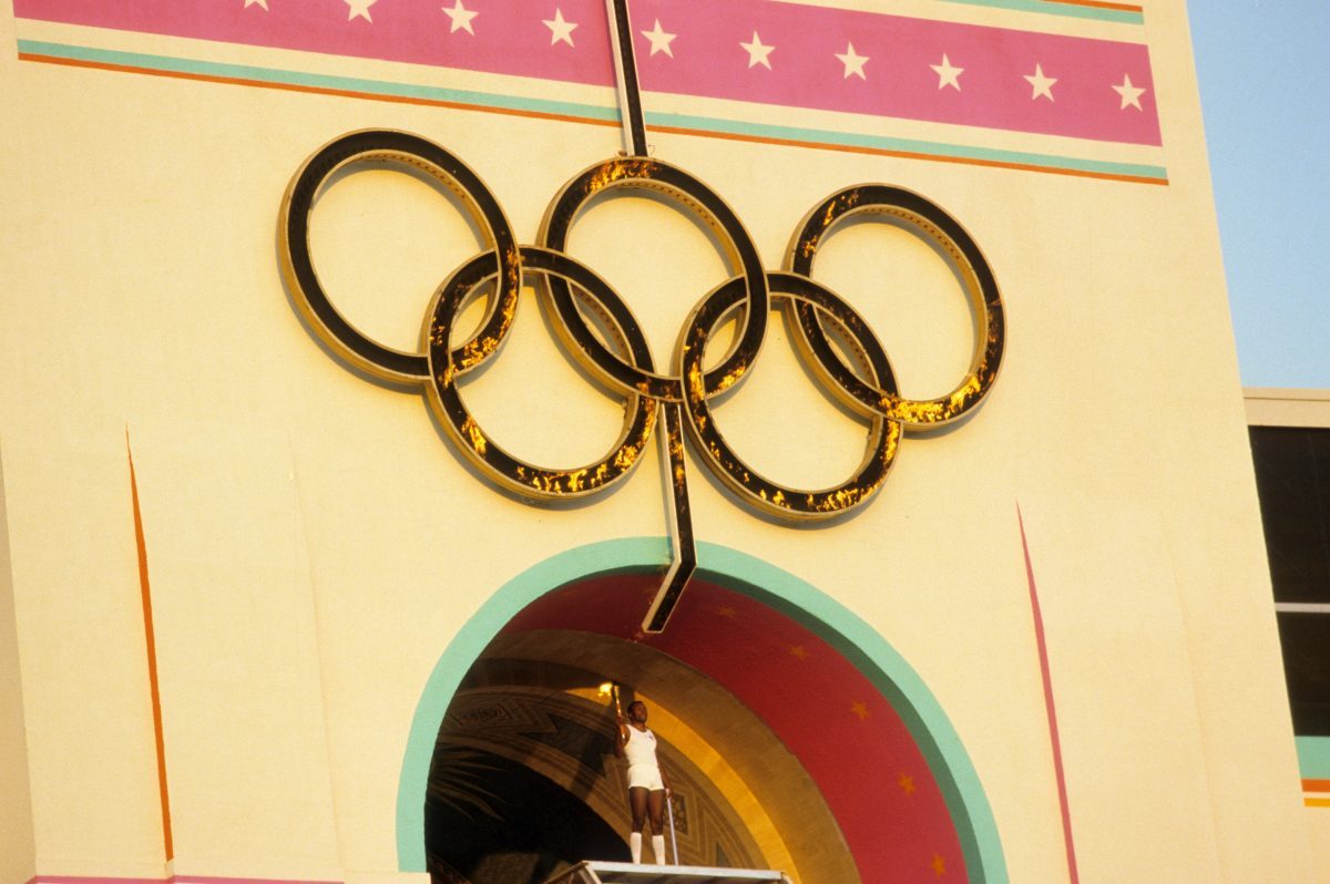 The U.S. 1960 Olympic decathlon gold medalist Rafer Johnson carrying Olympic torch before games at Los Angeles Memorial Coliseum.<br> CREDIT: Ronald C. Modra (Photo by Ronald C. Modra /Sports Illustrated via Getty Images)<br> (Set Number: X30350 T3 R24 F8 )