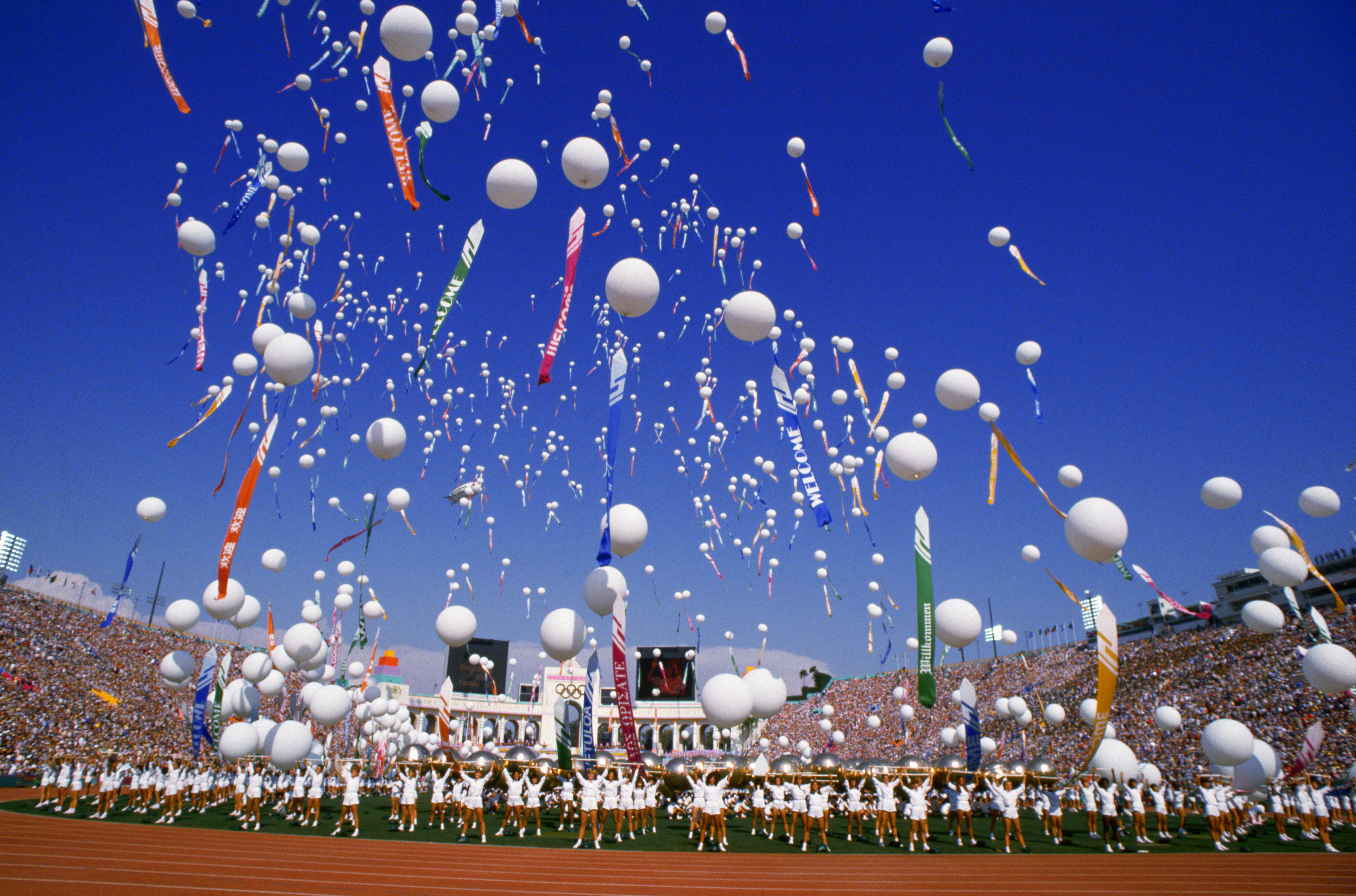 A host of balloons are released into the air by performers. 1984. (Photo by © Kit Houghton/CORBIS/Corbis via Getty Images)