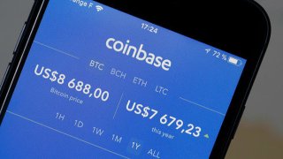 The Coinbase cryptocurrency exchange app pictured on the screen of an iPhone on February 12, 2018.