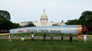 Members of the DC Marijuana Justice community hold a 51 blow-up joint on the National Mall ahead of President Joe Bidens address to a joint session of Congress to call on the administration to take action on legalization and expungement of criminal records on Wednesday, April 28, 2021.