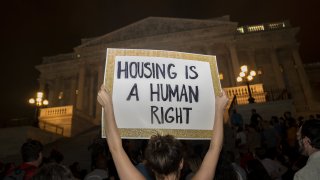 Demonstrators gather during a protest against the expiration of the eviction moratorium outside of the U.S. Capitol in Washington, D.C., U.S., on Sunday, Aug. 1, 2021.