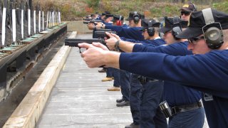 Connecticut state police recruits practice with their new .45-caliber Sig Sauer pistols during a "dry fire" exercise at the state police firing range in Simsbury, Connecticut, Oct. 24, 2012. A new use-of-force training program will be required for all police officers in Connecticut, Friday, Aug. 13, 2021. It will emphasize “moral courage,” empathy and de-escalation in an effort to reduce fatal shootings and other violent acts by officers.