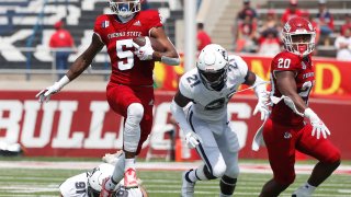 Fresno State's Jalen Cropper (5) runs past Connecticut's Collin McCarthy (91) during the first half of an NCAA college football game in Fresno, Calif., Saturday, Aug. 28, 2021.