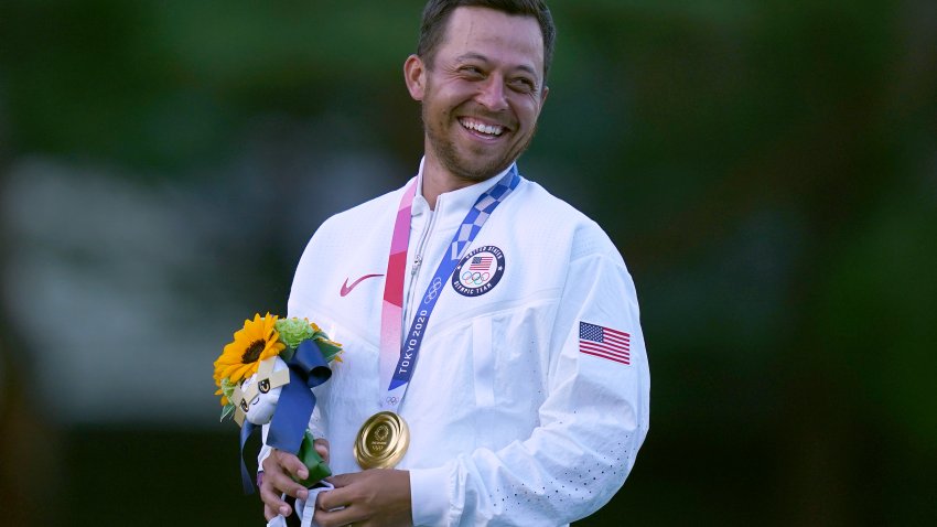 Team USA's Xander Schauffele celebrates with his gold medal after winning the Men's Individual Stroke Golf Tournament at the Kasumigaseki Country Club on the ninth day of the Tokyo 2020 Olympic Games in Japan. Picture date: Sunday Aug. 1, 2021.