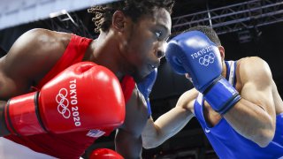 The USA's Keyshawn Davis, left, and ROC athlete Gabil Mamedov fight in their men's lightweight 63kg quarterfinal boxing bout at the Tokyo Olympic Games at Kokugikan Arena.