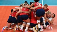USA's players celebrate their victory in the women's gold medal volleyball match between Brazil and USA during the Tokyo 2020 Olympic Games at Ariake Arena in Tokyo, Japan on Aug. 8, 2021.