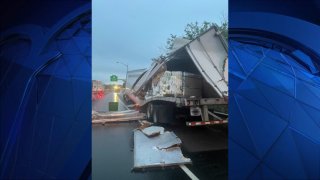 A tractor-trailer is torn open in North Haven