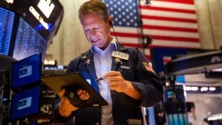 A trader works on the floor of the New York Stock Exchange (NYSE) in New York, U.S., on Monday, Aug. 23, 2021.