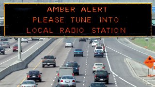 File - Amber Alert is displayed on sign over westbound Highway 401 on May 14, 2005.