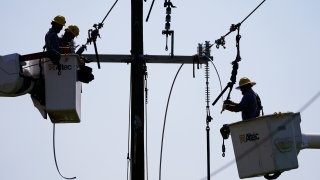 Crews work on power lines