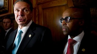 New York Gov. Andrew Cuomo, left, Alphonso David, right