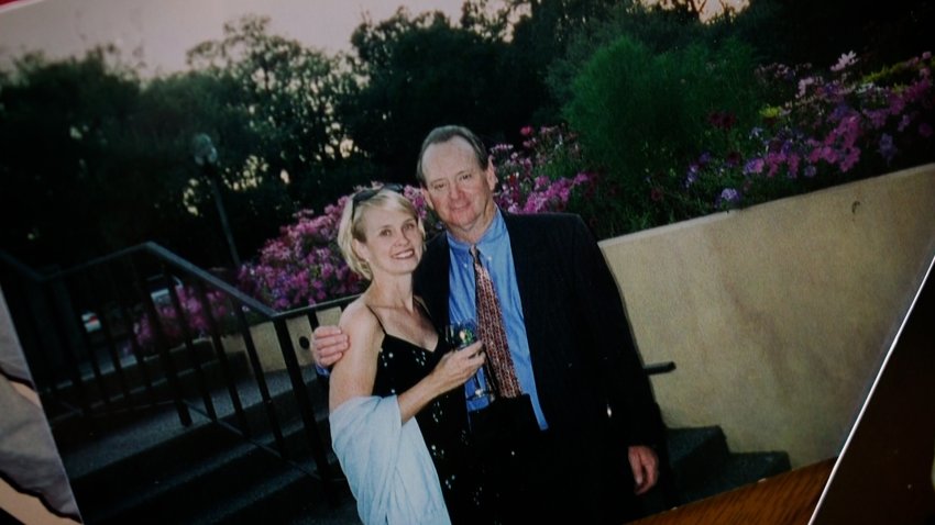 Melissa Harrington-Hughes poses with her father Bob Harrington for a photo.