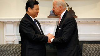 Xi Jinping, vice president of China, left, meets with U.S. Vice President Joe Biden in the Roosevelt Room at the White House in Washington, D.C., Feb. 14, 2012.