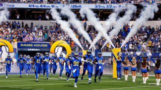 Los Angeles Rams defensive end Aaron Donald #99 leads the defense onto the field to play the Arizona Cardinals at SoFi Stadium in Inglewood on Sunday, October 3, 2021.