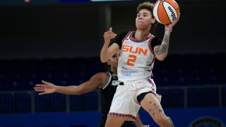 Connecticut Sun's Natisha Hiedeman (2) goes up for a last-second shot against Chicago Sky's Lexie Brown (7) during the first period of Game 3 of a WNBA semifinal playoff basketball game Sunday, Oct. 3, 2021, in Chicago.