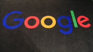 the logo of Google is displayed on a carpet at the entrance hall of Google France in Paris