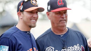 Houston Astros hitting coach Troy Snitker, left, stands by his father Braves manager Brian Snitker