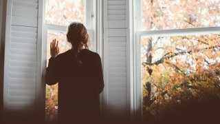 A woman looking through the window...