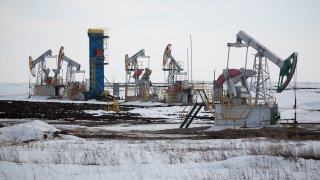 Oil pumping jacks, also known as “nodding donkeys,” operate in an oilfield near Almetyevsk, Tatarstan, Russia, on Wednesday, March 11, 2020.