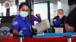 Transportation Security Administration (TSA) workers screen passengers at O’Hare International Airport on November 08, 2021 in Chicago, Illinois.