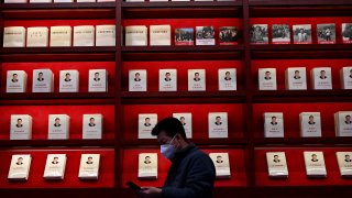 Books by and about Chinese President Xi Jinping fill a display at the Museum of the Communist Party of China in Beijing on November 11, 2021.