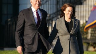 US President Joe Biden (L) and US Vice President Kamala Harris arrive during a signing ceremony for H.R. 3684, the Infrastructure Investment and Jobs Act on the South Lawn of the White House in Washington, DC on November 15, 2021.