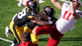 Nebraska tight end Austin Allen (11) catches a pass over Iowa defensive back Jack Koerner (28)