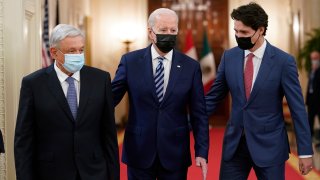 President Joe Biden walks with Mexican President Andrés Manuel López Obrador and Canadian Prime Minister Justin Trudeau to a meeting in the East Room of the White House in Washington, Thursday, Nov. 18, 2021.