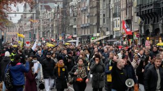 Thousands take part in a demonstration against COVID-19 restrictions in Amsterdam, Netherlands
