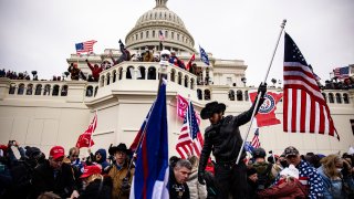 FILE - Pro-Trump supporters storm the U.S. Capitol following a rally with President Donald Trump on Jan. 6, 2021 in Washington, D.C.