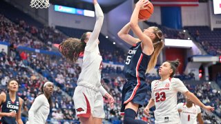 UConn Huskies guard Paige Bueckers (5) shoots over Arkansas Razorbacks guard Sasha Goforth