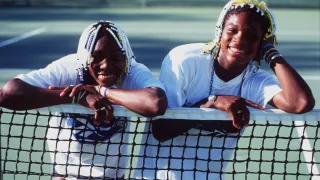 Teenage tennis sisters from America, Venus (left) and Serena Williams take time off a practise session to pose together during the Adidas International event at White City in Sydney, Australia in 1998.