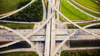 Aerial view of traffic and overpasses.