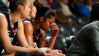 Connecticut guard Evina Westbrook (22) sits on the bench in the final moments of the team's loss to Georgia Tech in an NCAA college basketball game Thursday, Dec. 9, 2021, in Atlanta.