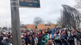 A street sign is unveiled to honor slain rapper Young Dolph, whose real name is Adolph Thornton Jr., on Wednesday, Dec. 15, 2021, in Memphis, Tenn.