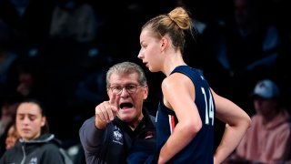 Connecticut coach Geno Auriemma talks to forward Dorka Juhasz (14) during the first half of the team's NCAA college basketball game agains Georgia Tech on Thursday, Dec. 9, 2021, in Atlanta.