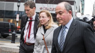 Marci Palatella, founder of Preservation Distillery, center, arrives at federal court in Boston, Massachusetts, U.S., on Friday, March 29, 2019. Wealthy parents appeared in court as the clock ticks down on plea bargains for their alleged role in the biggest college admissions scam the Justice Department has ever prosecuted.