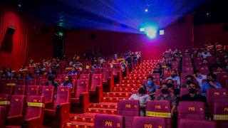 People sitting in a theater in Dubai