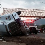 ruck that was transporting migrants is seen rolled over